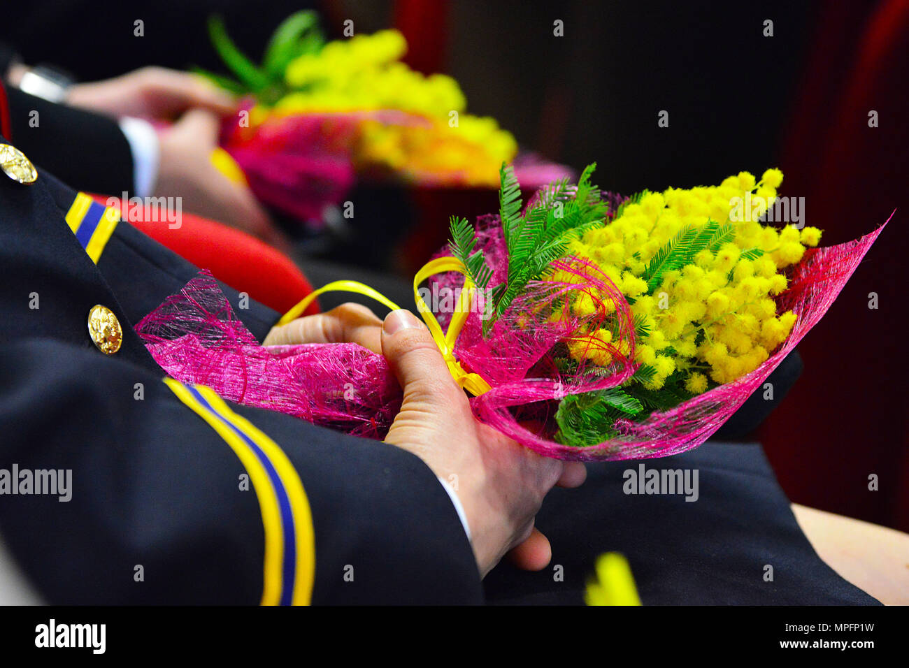 Opening ceremony of the 5th “Gender Protection in Peace Operations” Course and “International Woman Day” at the  Center of Excellence for Stability Police Units (CoESPU) in Vicenza, Italy, Mar. 8, 2017. In Honor of the occasion, all female guests were presented with the traditional Italian gift of a branch of mimosa flowers as a sign of respect and solidarity for women`s issues. (U.S. Army Photo by Visual Information Specialist Paolo Bovo/released) Stock Photo